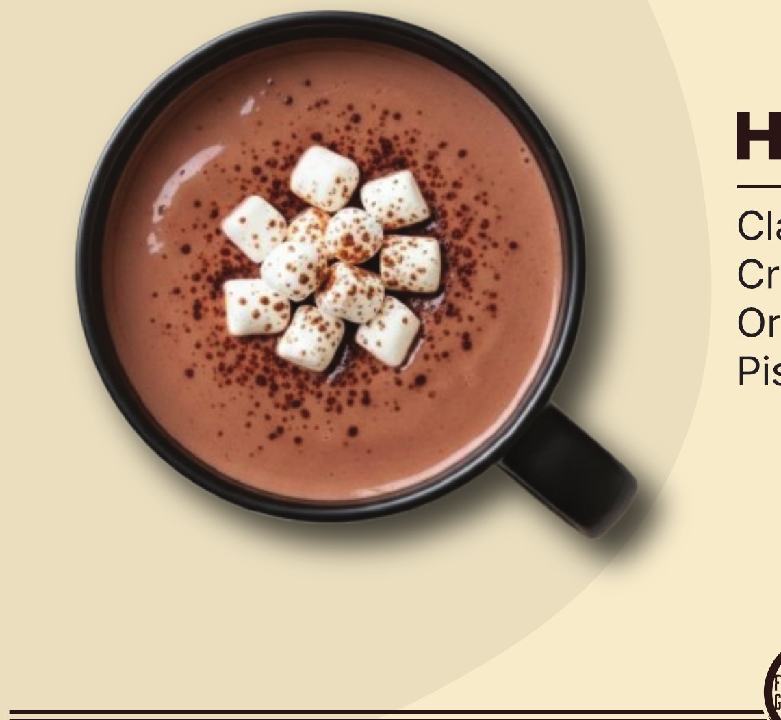 Hot chocolate topped with mini marshmallows and cocoa powder