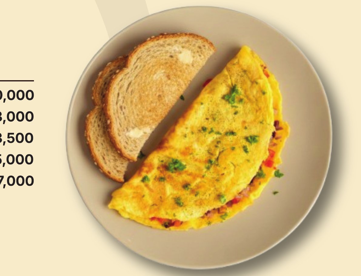 Omelette with herbs, served with slices of toasted bread
