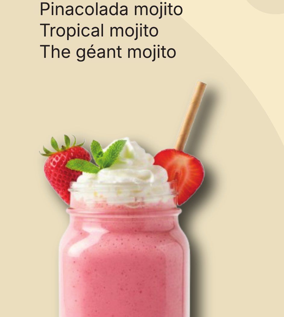 Strawberry smoothie topped with whipped cream and fresh strawberries